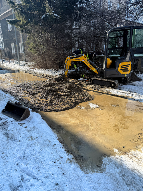 Blue digital watch on a dark liver background.